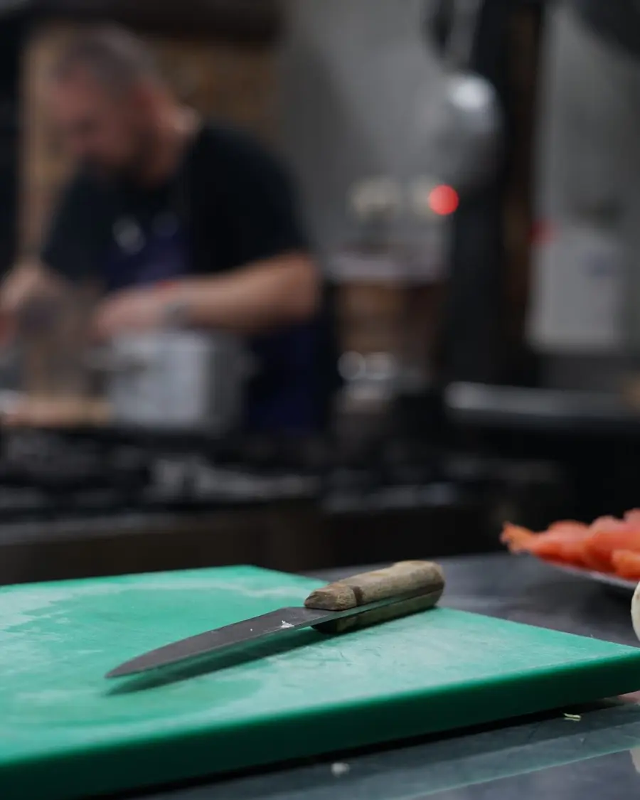 A cook at work in a restaurant kitchen
